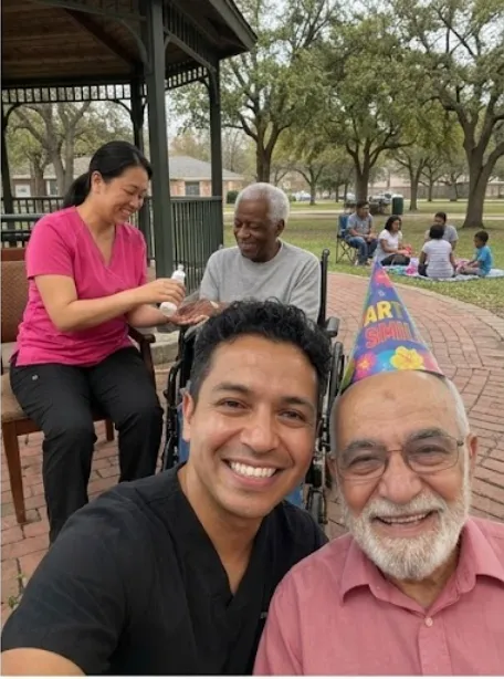 Caregivers and clients celebrating a birthday together in the park
