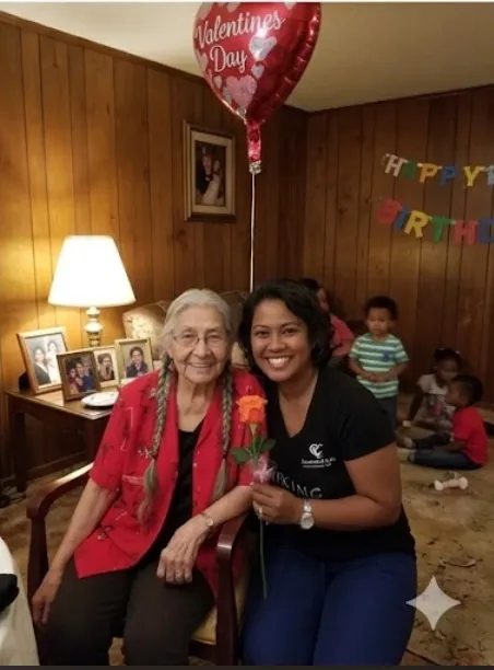 An Ama Ultimate caregiver celebrating Valentine's Day with a senior client at home